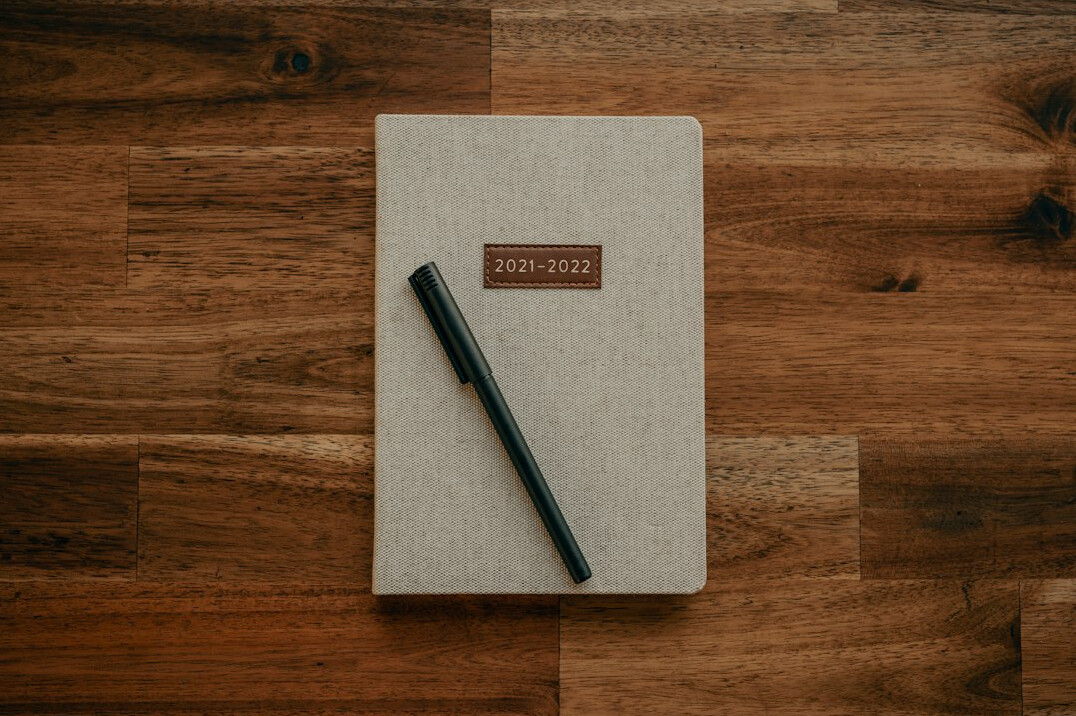 writer at desk with notebook