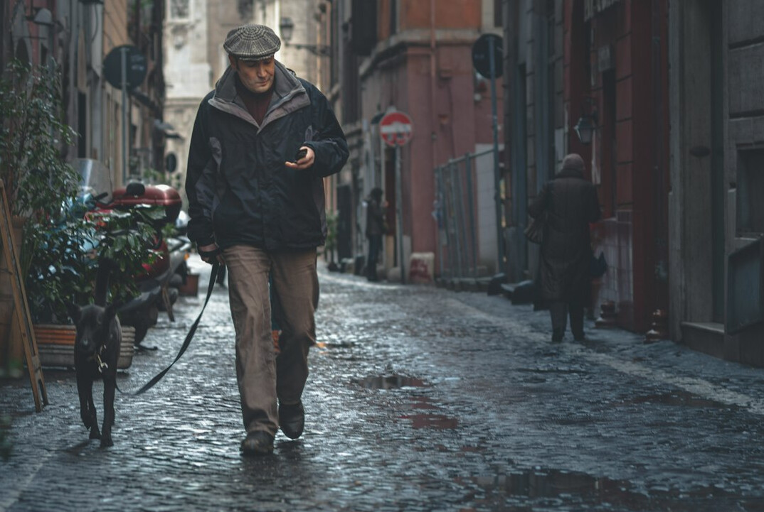 detective walking in rain