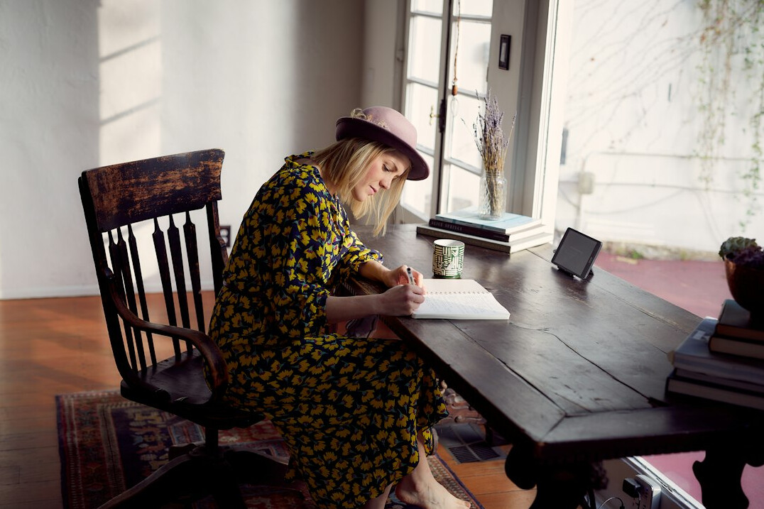 woman reading manuscript