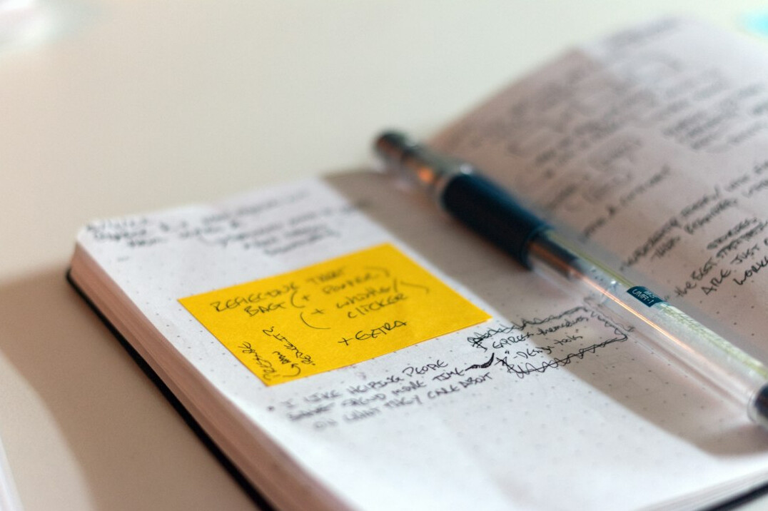 open notebook with handwritten notes
